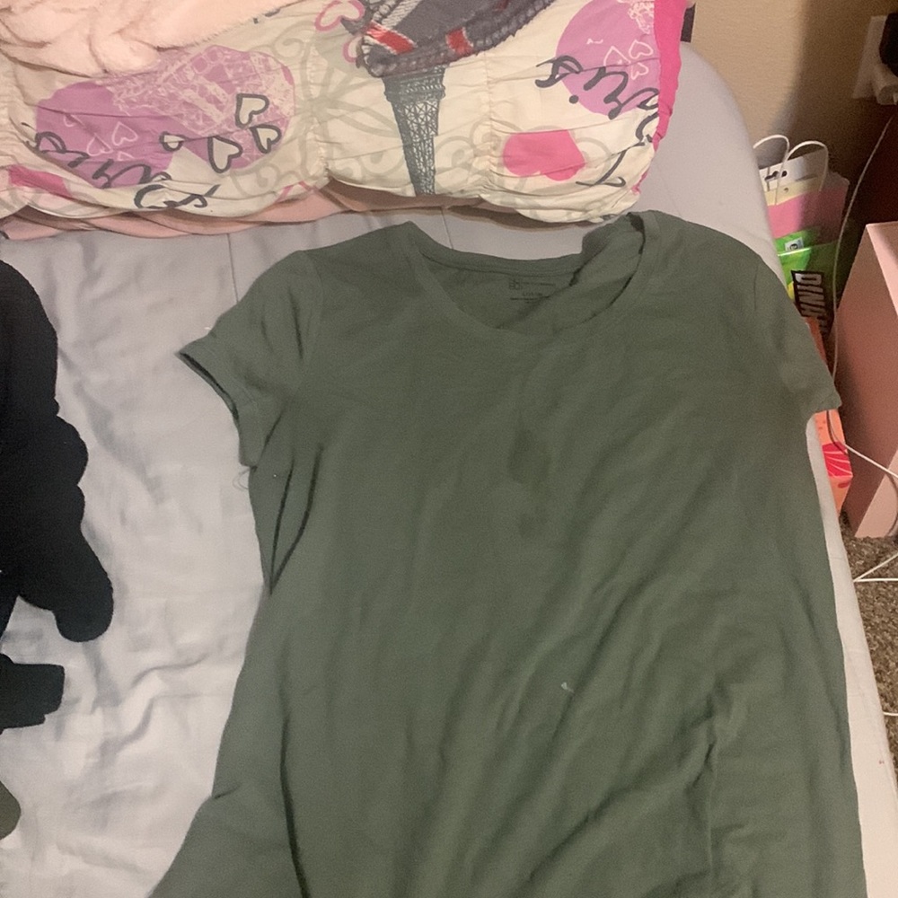blue and green shirt has tiny stains as shown in pictures